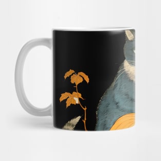 Japanese Cat on a Halloween Pumpkin During the Halloween Season on a dark (knocked out) background Mug